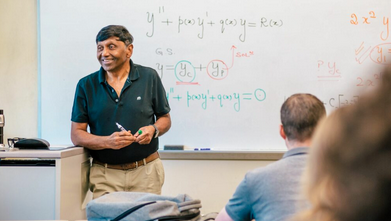 Dr. Ratnasingham Shivaji teaching math to UNCG students